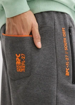 Hombre bonprix bonprix Pantalones de chándal con prácticos bolsillos con cremallera, confeccionados en algodón orgánico